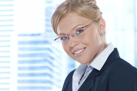 Portrait of young beautiful woman in office environment