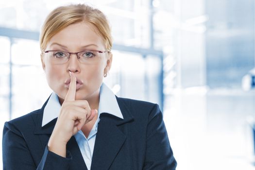 Portrait of young beautiful woman in office environment