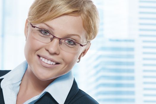 Portrait of young beautiful woman in office environment