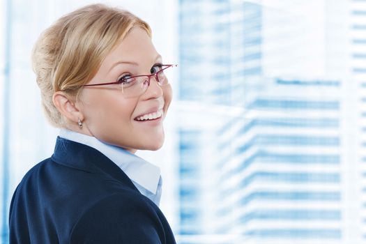 Portrait of young beautiful woman in office environment