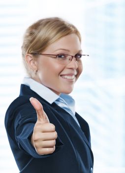 Portrait of young beautiful woman in office environment