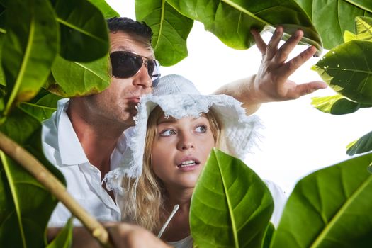 Portrait of young nice couple having good time inj tropic environment