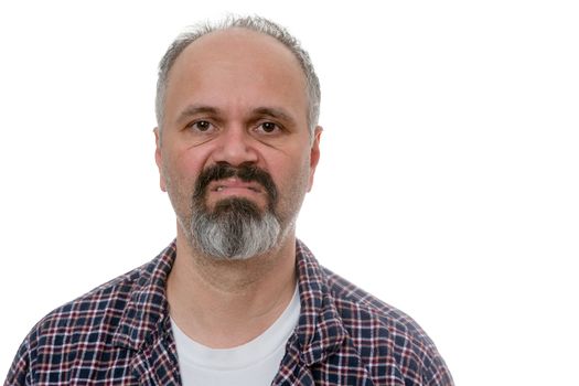 Single balding grumpy old man in beard, mustache and plaid pyjamas with angry expression over white undershirt