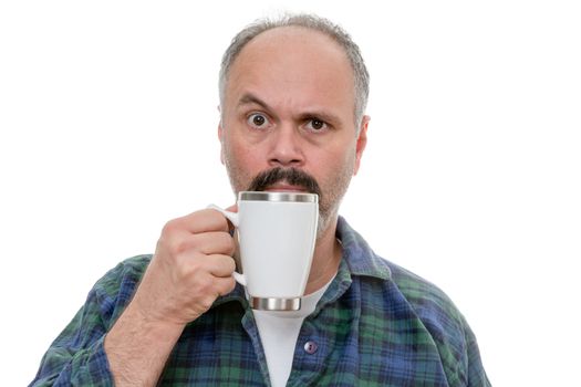 Single middle aged man with white coffee mug near face and puzzled or funny expression as he raises one eyebrow over white background