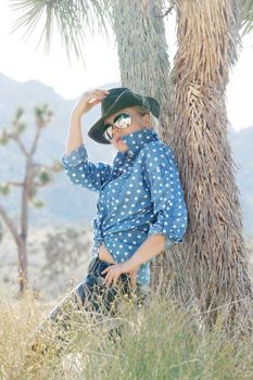 portrait of young beautiful girl in Joshua Tree park environment