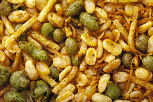 Dry roasted Indian snack mix, close-up background
