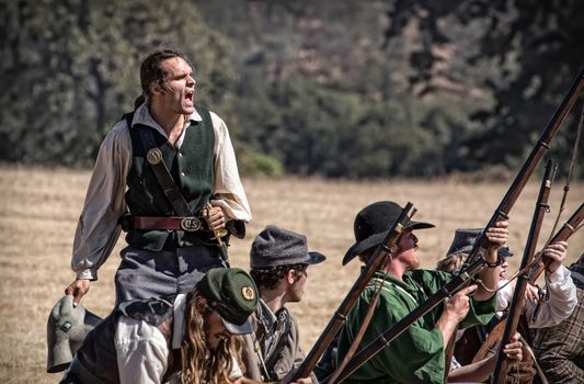 Confederate soldiers reload and fire at the Union during a Civil War Reenactment at Anderson, California.
Photo taken on: September 27th, 2014