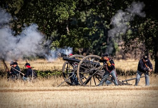 A Union cannon battery stands ready for action during a Civil War Reenactment at Anderson, California.
Photo taken on: September 27th, 2014