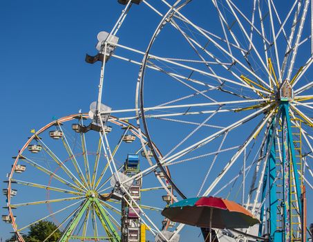 Two Ferris Wheels at the county fair.