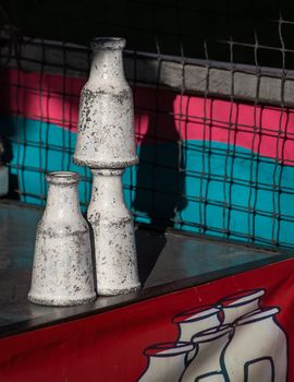 The milk bottle game at the county fair. Knock the bottle down and win a prize!
Photo taken on: June 17th, 2015