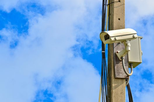 closed circuit camera on blue sky  background