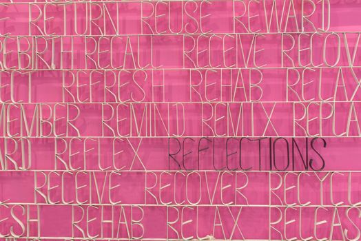 Reflection text on a pink background with prefix RE words.