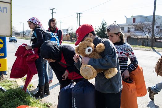 GREECE, Diavata: Migrants walk from Diavata, near Thessaloniki, Greece toward Idomeni border's crossing, on February 25, 2015. Hundreds left Diavata camp, a refugee center near Thessaloniki to reach the Greek-Macedonian border. 