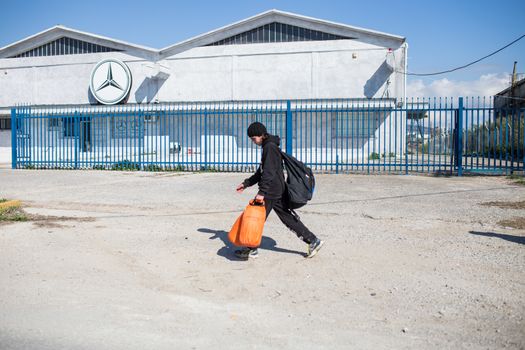 GREECE, Diavata: Migrants walk from Diavata, near Thessaloniki, Greece toward Idomeni border's crossing, on February 25, 2015. Hundreds left Diavata camp, a refugee center near Thessaloniki to reach the Greek-Macedonian border. 