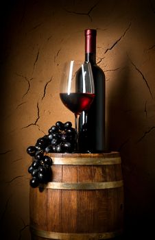 Wine on barrel in cellar with clay wall