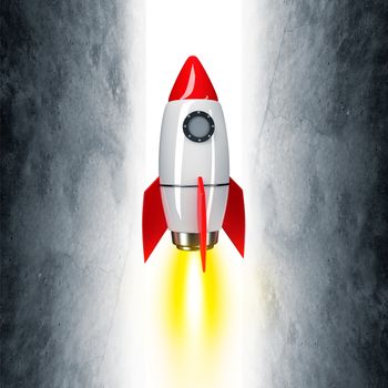 Space rocket with fire on grey wall background
