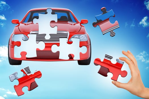 Hand making car puzzle on blue sky