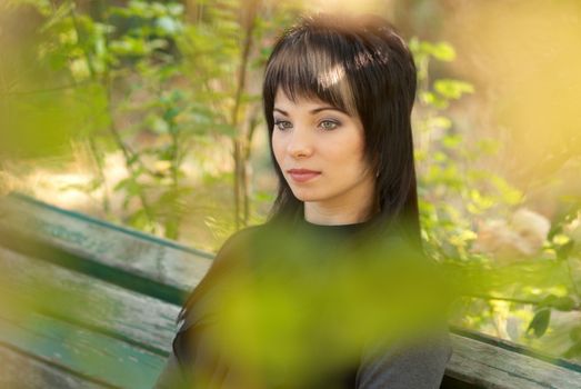 Beautiful girl's portrait with soft autumn background