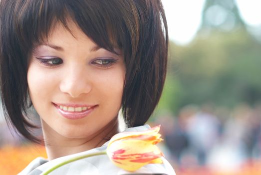 Pretty girl with tulips with soft background