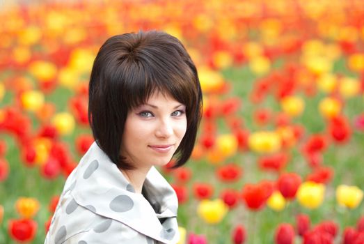 Pretty girl with tulips with soft background