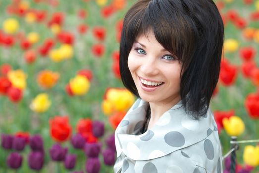 Pretty girl with tulips with soft background