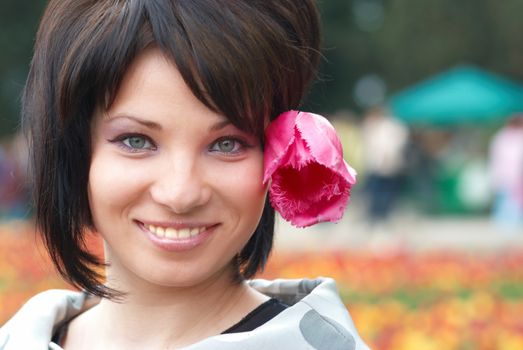 Pretty girl with tulips with soft background