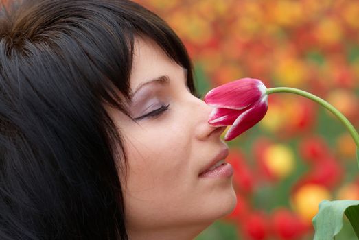 Pretty girl with tulips with soft background