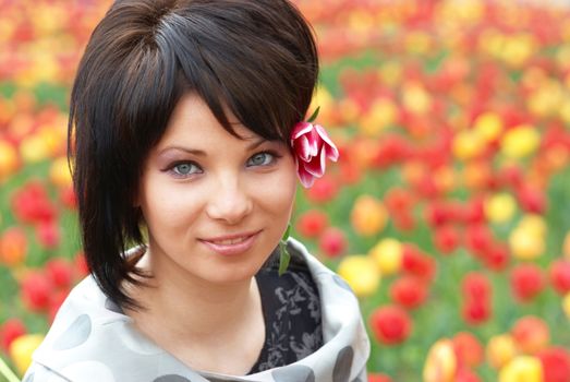 Pretty girl with tulips with soft background