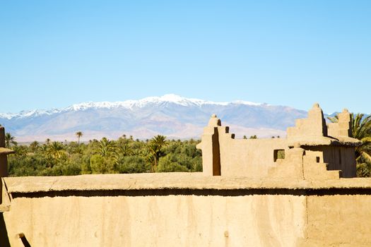 brown old  construction in  africa morocco and  clouds  near the tower 