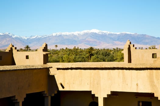 brown old  construction in  africa morocco and  clouds  near the tower 