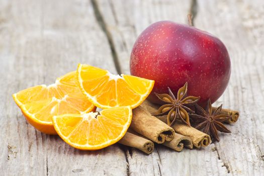 fruits and spises on wooden background