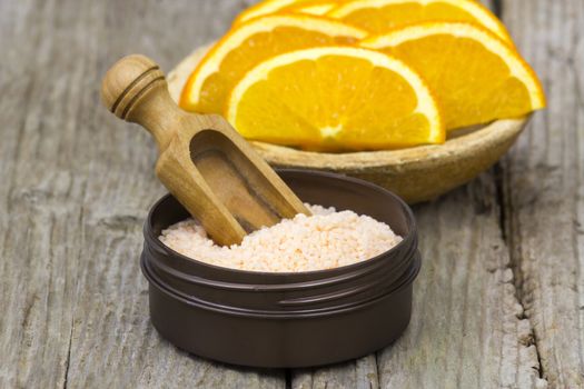 orange bath salt and fresh fruits - beauty treatment