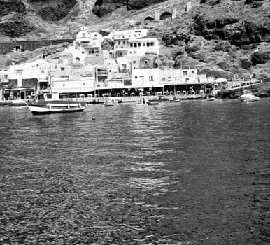 from    boat   in europe greece santorini island house and rocks the sky