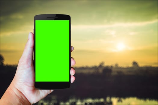 Modern mobile phone in the hand,on blur background image 