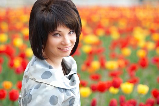 Pretty girl with tulips with soft background