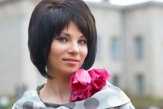 Pretty girl with tulips with soft background