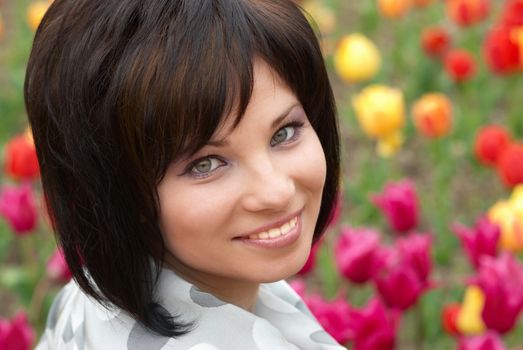 Pretty girl with tulips with soft background