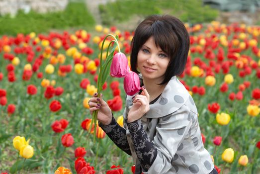 Pretty girl with tulips with soft background