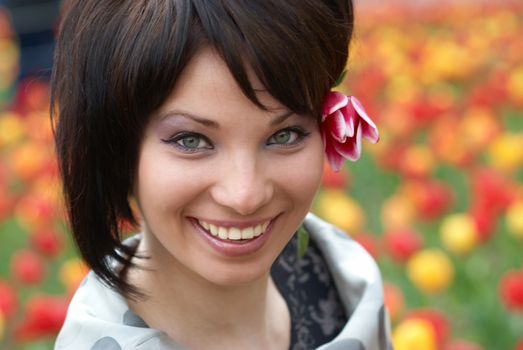 Pretty girl with tulips with soft background