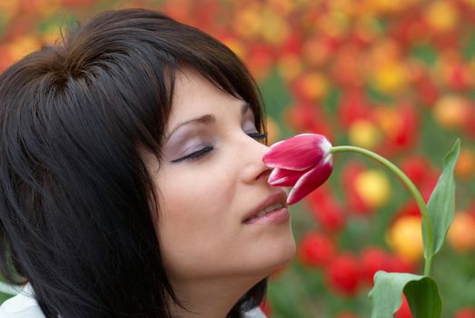 Pretty girl with tulips with soft background