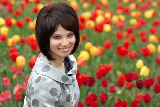 Pretty girl with tulips with soft background