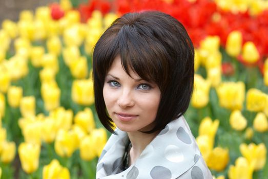 Pretty girl with tulips with soft background