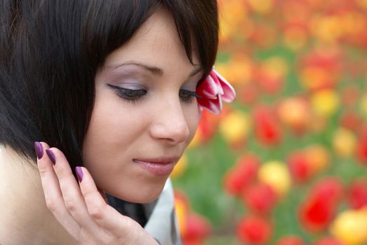 Pretty girl with tulips with soft background