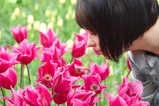 Pretty girl with tulips with soft background