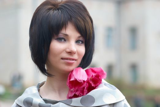 Pretty girl with tulips with soft background