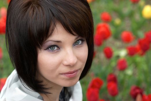 Pretty girl with tulips with soft background