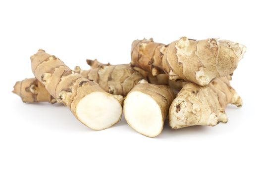 species edible tuber with root on white