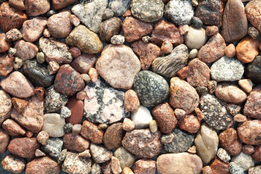 wet colourful stones,little and big as background