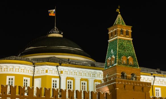 Kremlin in Moscow at night in the winter and Russian flag 2016