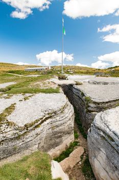 Trench dug in the rock dating back to World War I located on the Italian alps.